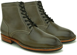 Forest green Goodyear-welted boots with sturdy sole and premium leather construction