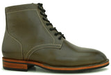 Forest green Goodyear-welted boots styled for outdoor wear and everyday durability