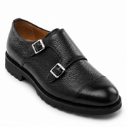 Close-up view of black leather double monk strap shoe