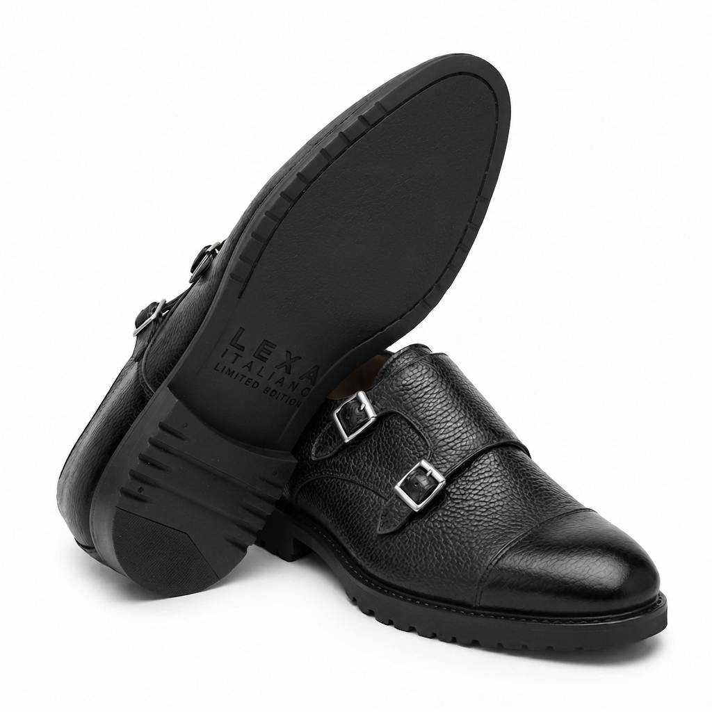 Black double monk strap leather shoes showing sole