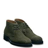 Men’s suede leather Chukkas boots showcasing lace-up design and sleek casual silhouette