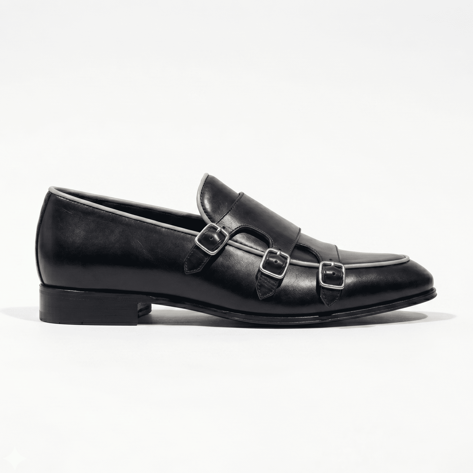 Side silhouette of black leather monk strap dress shoes for men