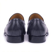Back view of black leather horsebit loafers showing heel and leather finish
