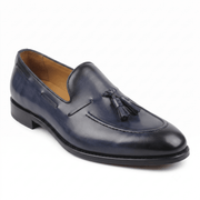 Side angled view of black leather horsebit loafers for men
