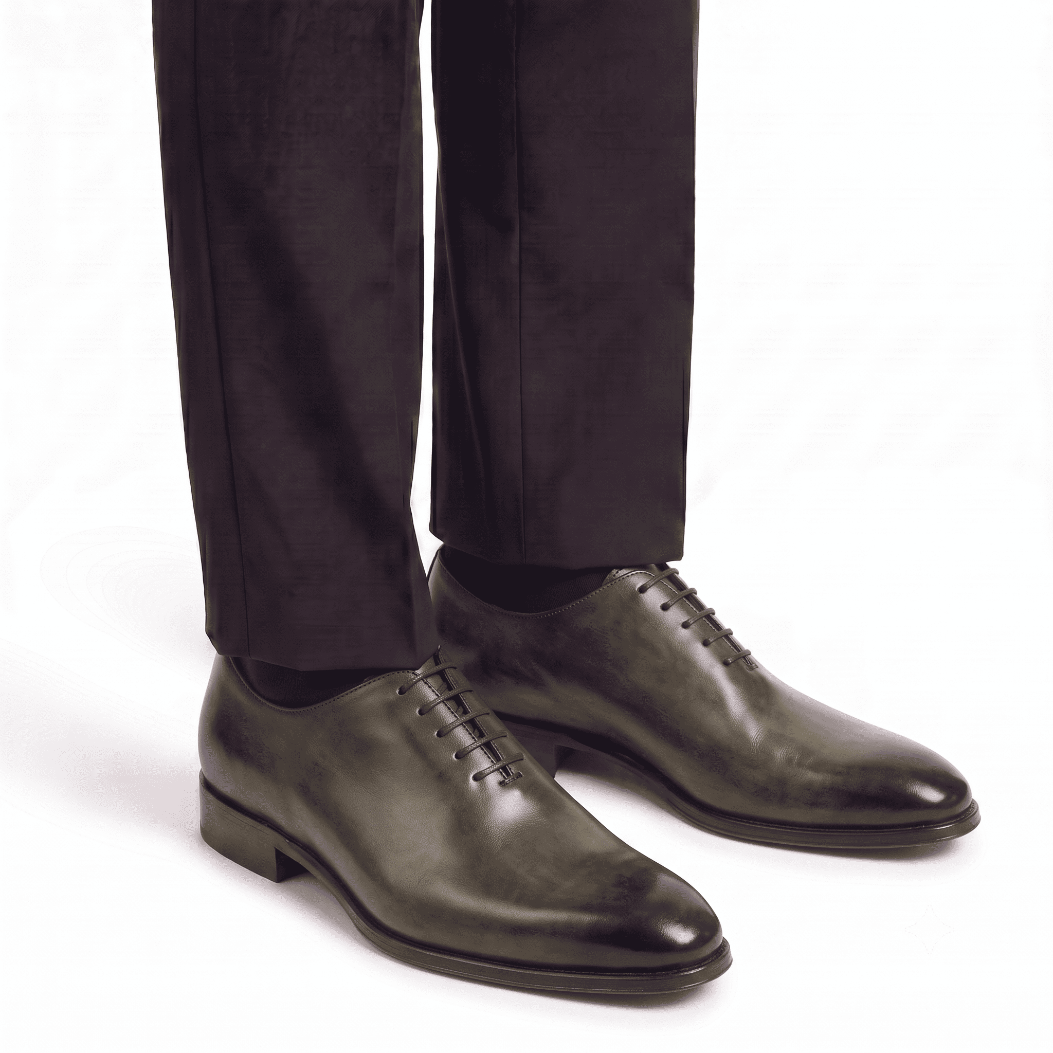 Olive green leather Oxford shoes worn with formal trousers