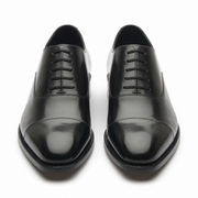 Black leather Oxford shoes for men showing the rounded toe and polished leather