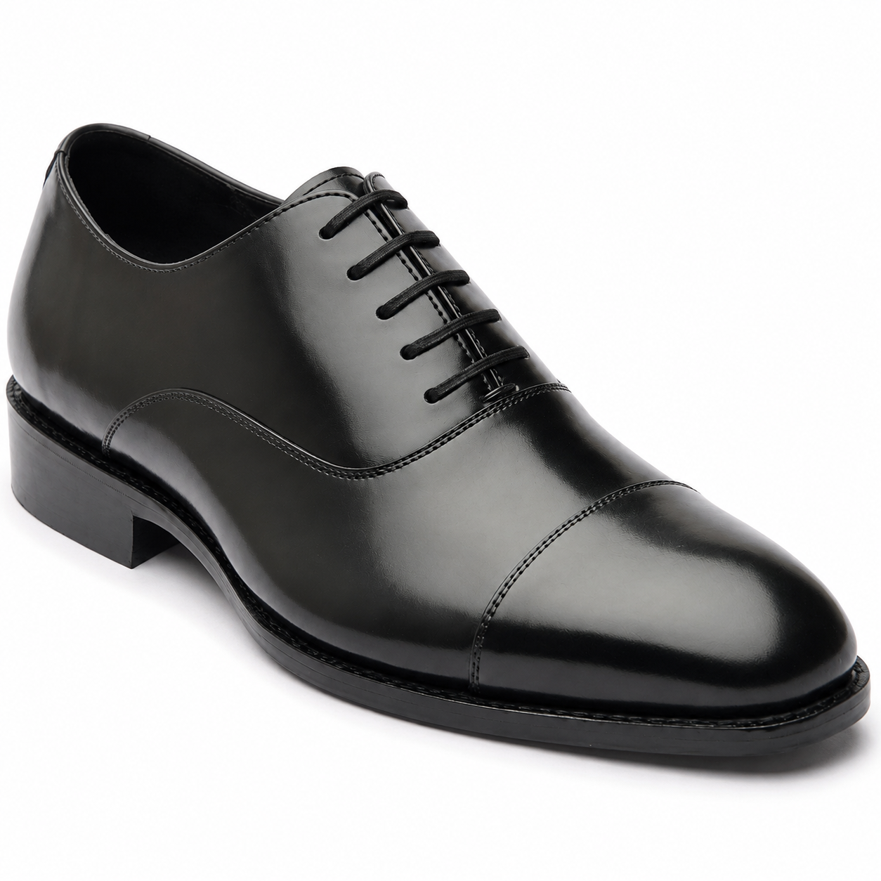Black leather Oxford shoe showing its sleek profile and low heel