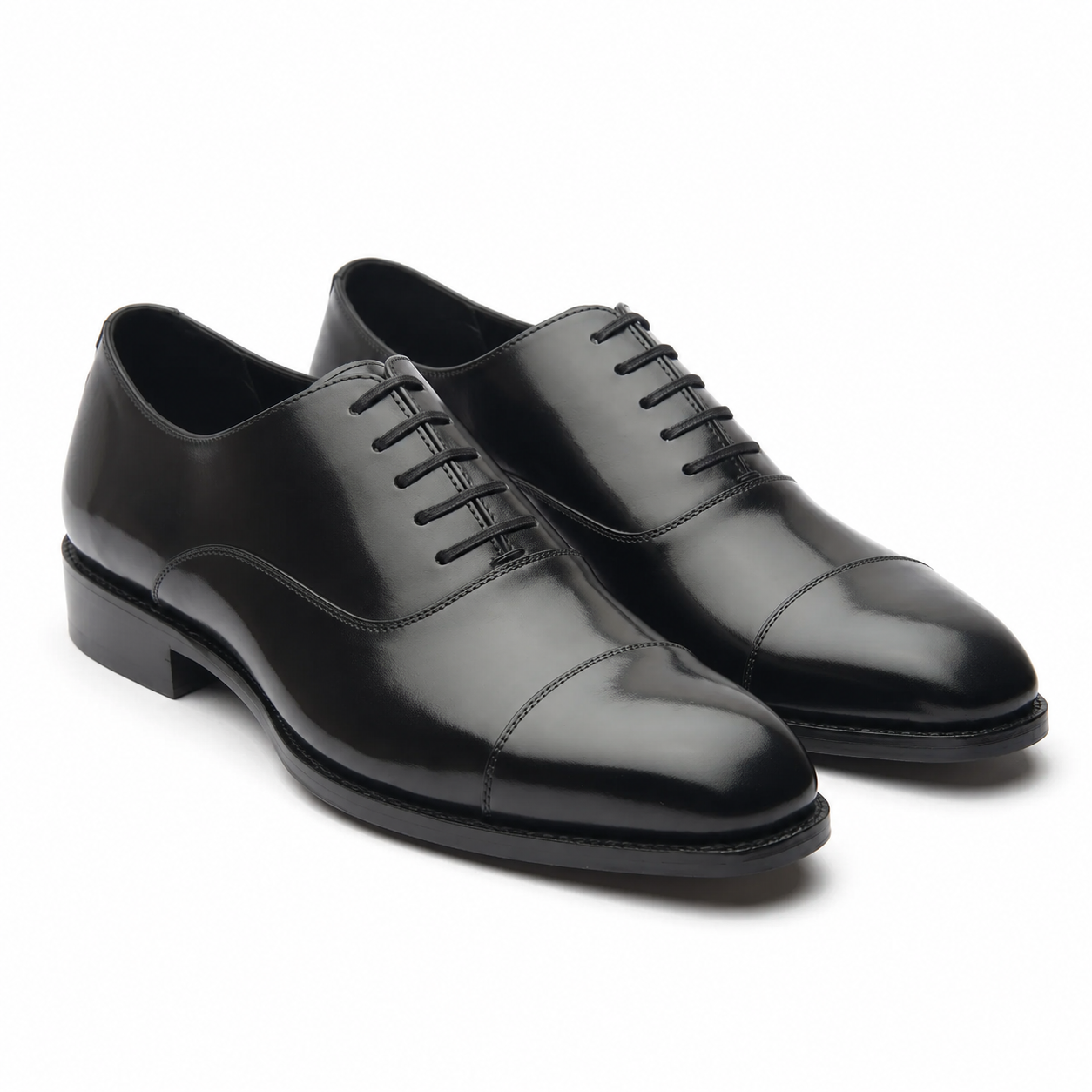 Black leather Oxford shoes for men with polished finish and classic cap-toe design