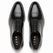 Pair of black leather Oxford shoes for men viewed from above