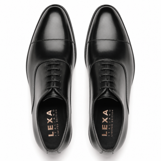 Pair of black leather Oxford shoes for men viewed from above