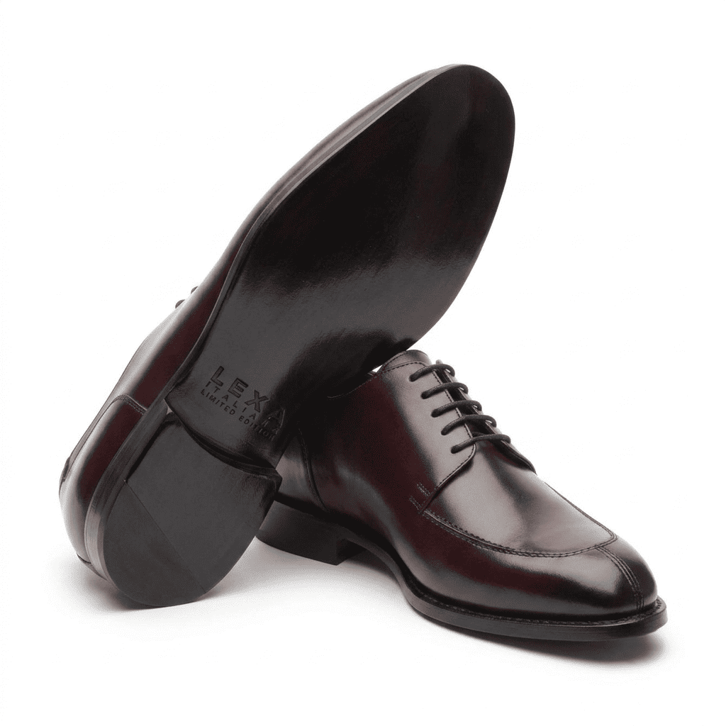 Angled view of dark brown leather Oxford shoes showing the soles