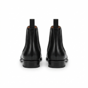 Pair of black leather Chelsea boots front view