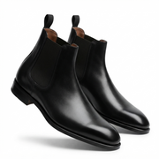 Black leather Chelsea boots angled view