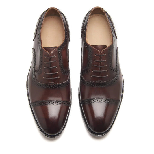 Brown hand-welted patina quarter brogue shoes – front view