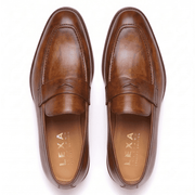 Top view of brown leather penny loafers for men