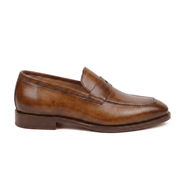 Side view of brown leather penny loafers showing leather sole