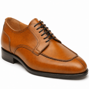 Brown leather Oxford shoe showing side profile and polished finish
