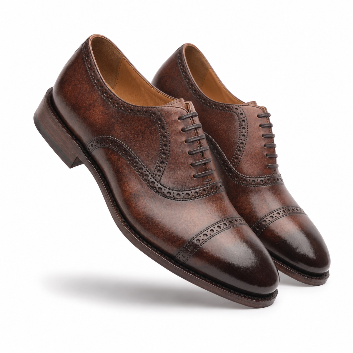 Pair of brown leather brogue dress shoes for men