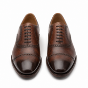 Front view of brown leather brogue shoes for men