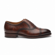 Brown leather brogue shoe side profile