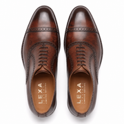 Top view of brown leather brogue shoes for men
