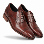 Angled view of handcrafted brown leather brogue shoes