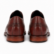 Back view of brown leather brogue shoes for men