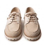 Front-facing pair of the beige suede shoes highlighting the moc-toe design and round matching laces.