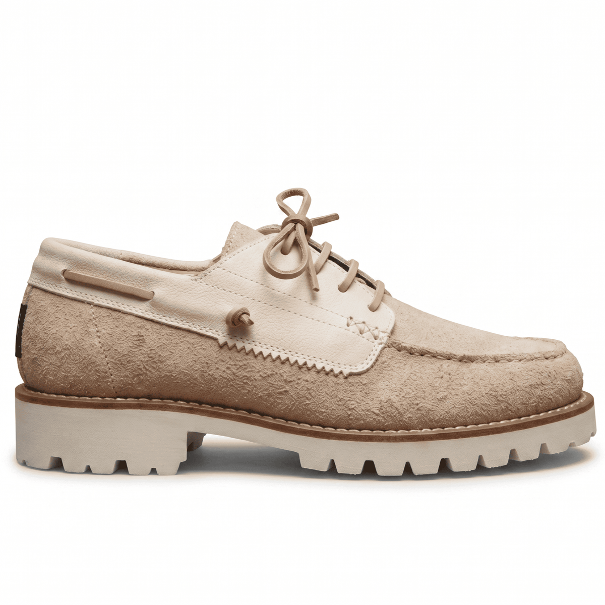 Clean side profile of the beige suede shoe highlighting the hybrid deck-shoe silhouette and chunky midsole.