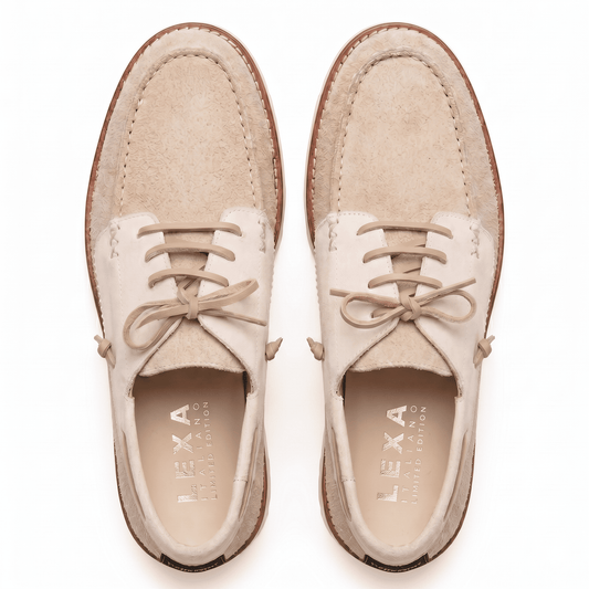 Top-down view of men's beige suede shoes highlighting the cream leather eyelet panels and gold-branded insoles.