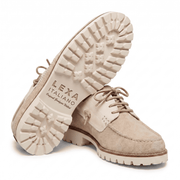 Side-by-side view showing the deep tread pattern of the cream lug sole and the side profile of the shoe.