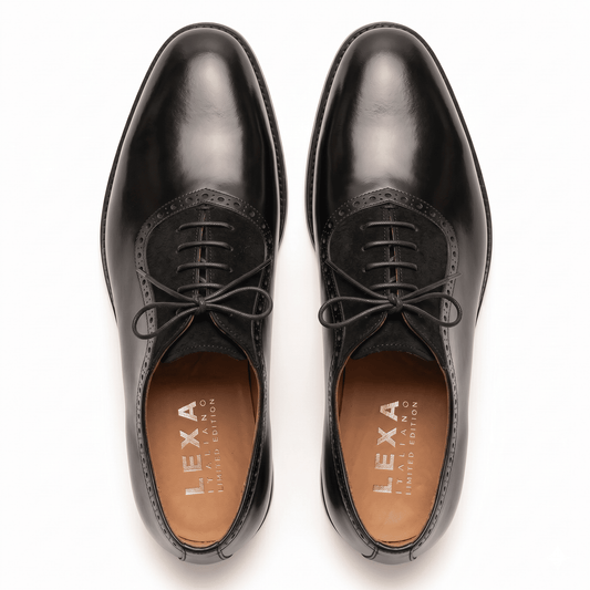 Overhead view of black formal Oxfords showing the almond toe shape, waxed laces, and tan leather interior lining.