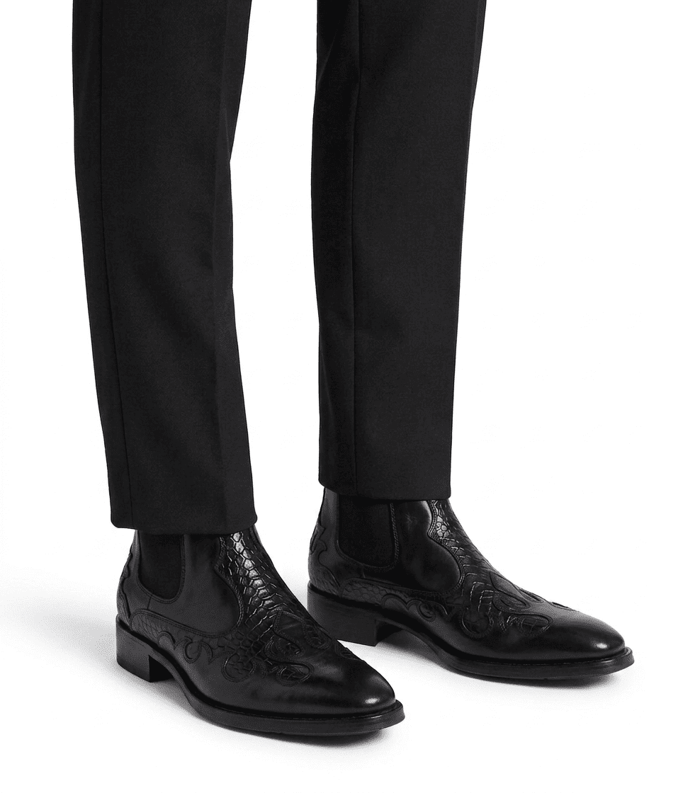 Professional lifestyle shot of the embroidered black boots paired with tailored black trousers for a sleek look.
