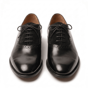 Front-facing view of the pair highlighting the symmetrical lacing system and the high-shine finish on the toes.