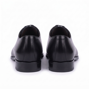 Rear view of handcrafted black genuine leather Oxford shoes for men showcasing the premium heel and refined finish.
