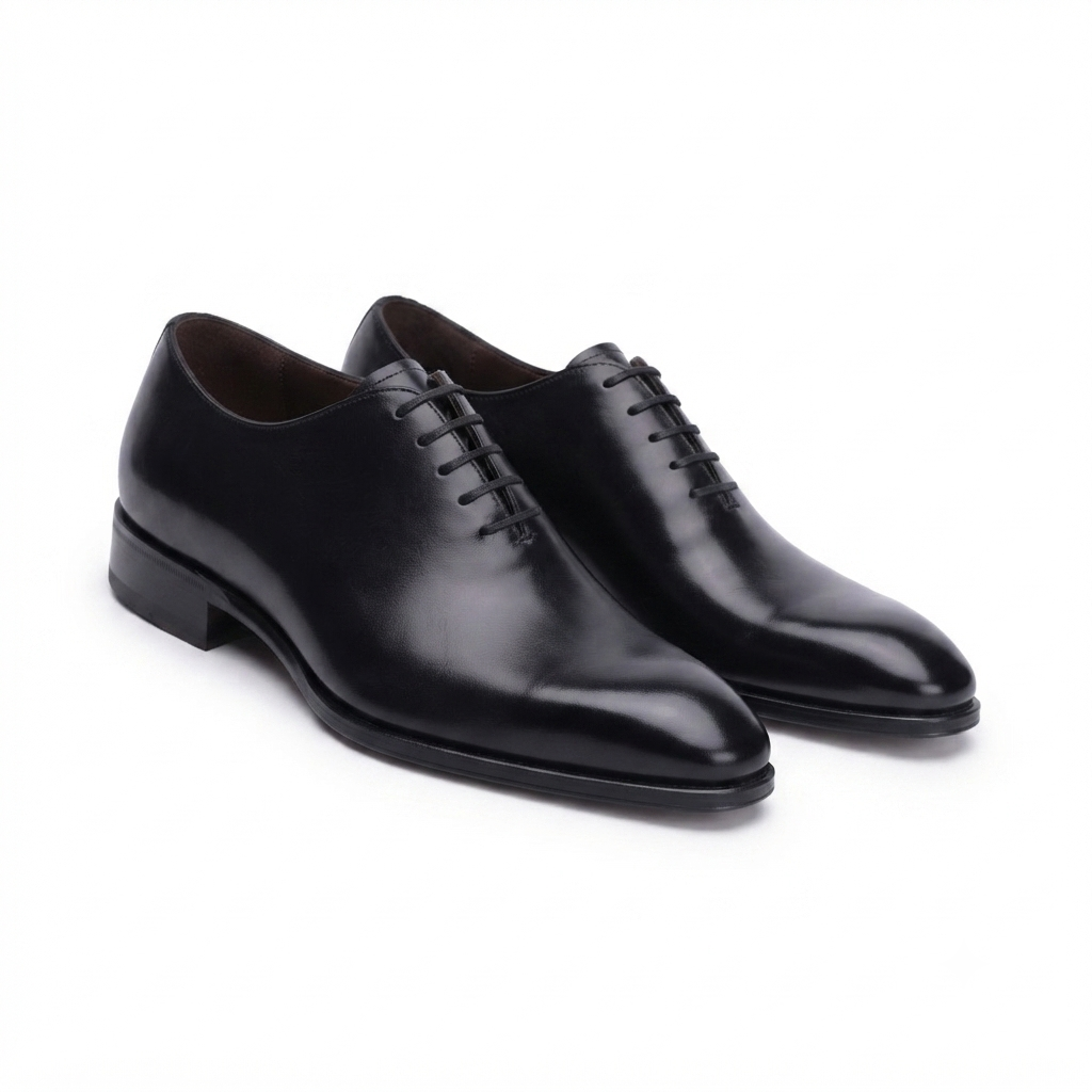 Black leather Oxford shoes for men handcrafted from premium genuine leather with a classic lace-up formal design.
