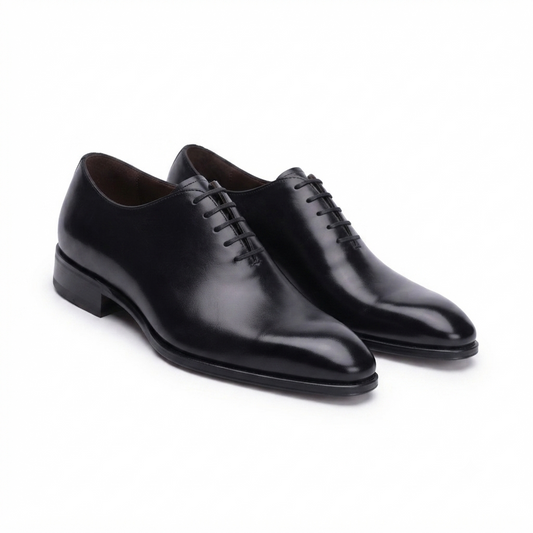 Black leather Oxford shoes for men handcrafted from premium genuine leather with a classic lace-up formal design.