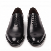 Front view of black leather Oxford dress shoes for men featuring a polished toe and classic lace-up design.