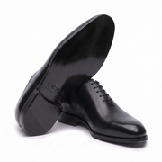 Bottom sole view of premium black leather Oxford shoes for men highlighting the durable outsole and quality construction