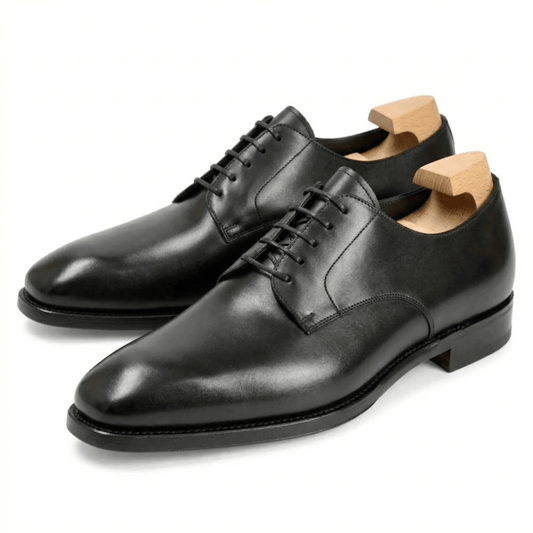 Angled view of black leather Oxford shoes for men
