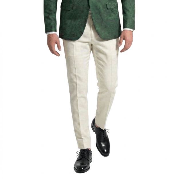 Front styling view of black Oxford shoes with green blazer and white trousers