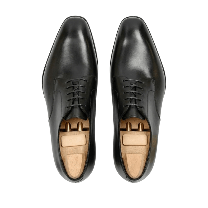 Top view of black leather Oxford shoes for men
