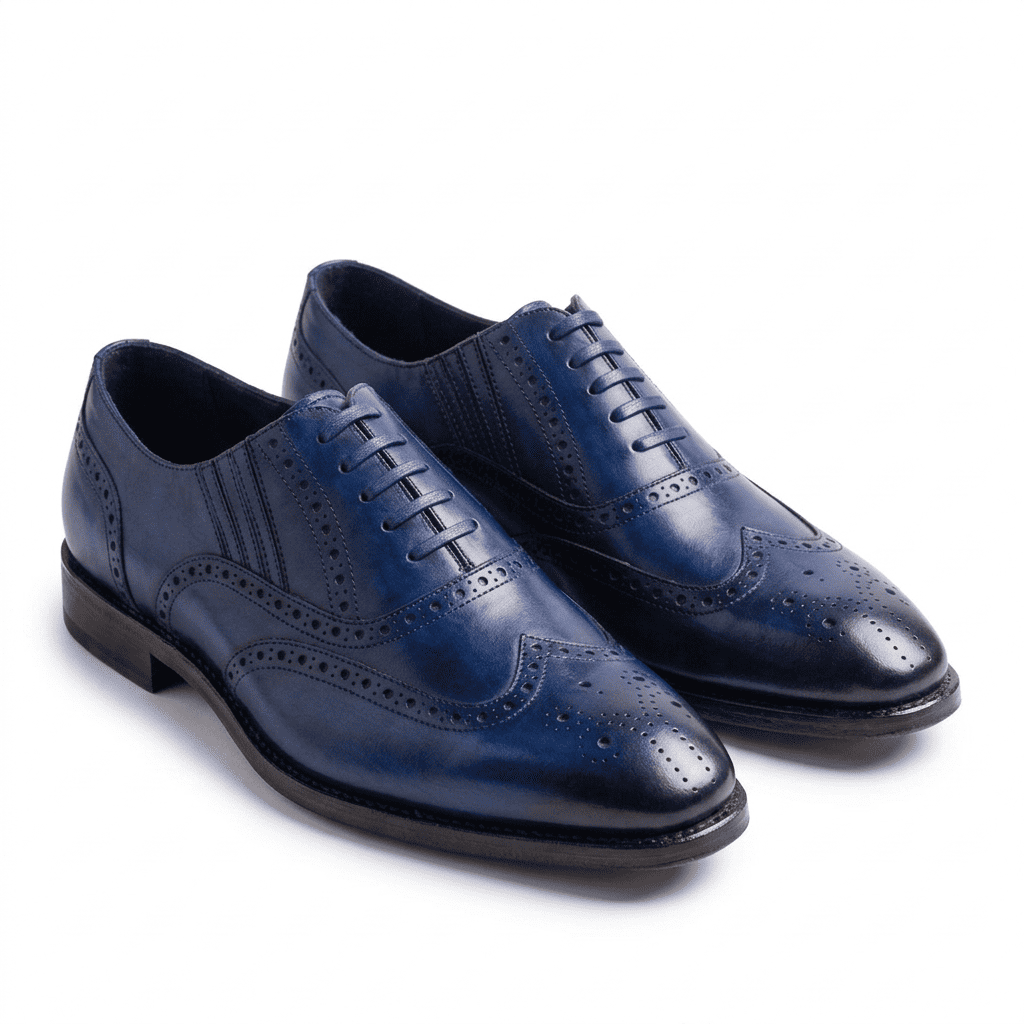 Blue leather wingtip Oxford shoes for men with brogue detailing angled view