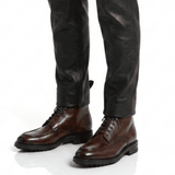 Men wearing brown leather ankle boots styled with casual outfit