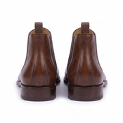Rear view of handcrafted brown leather Chelsea boots for men highlighting the pull tabs and premium heel construction.