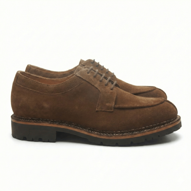 Side profile of brown suede leather derby shoes