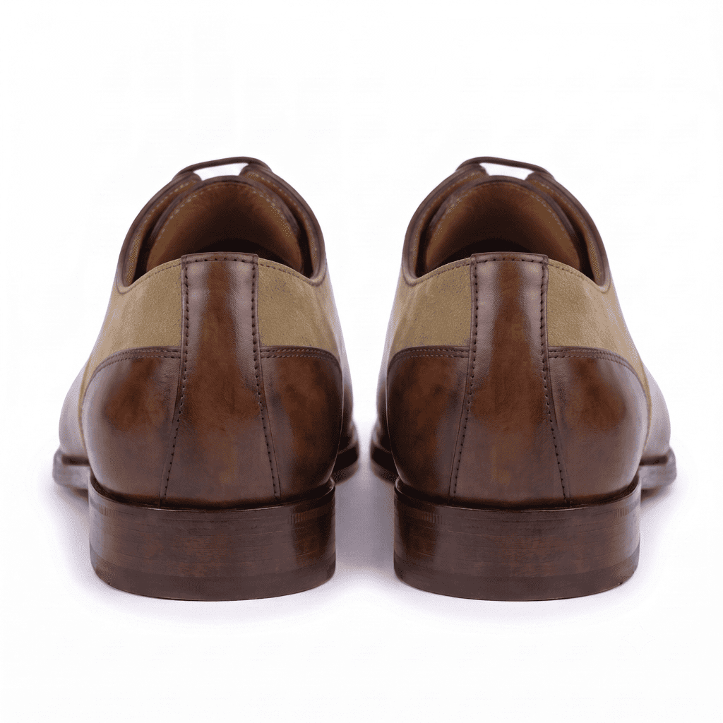 Rear view of handcrafted brown and tan Oxford leather shoes with premium heel construction