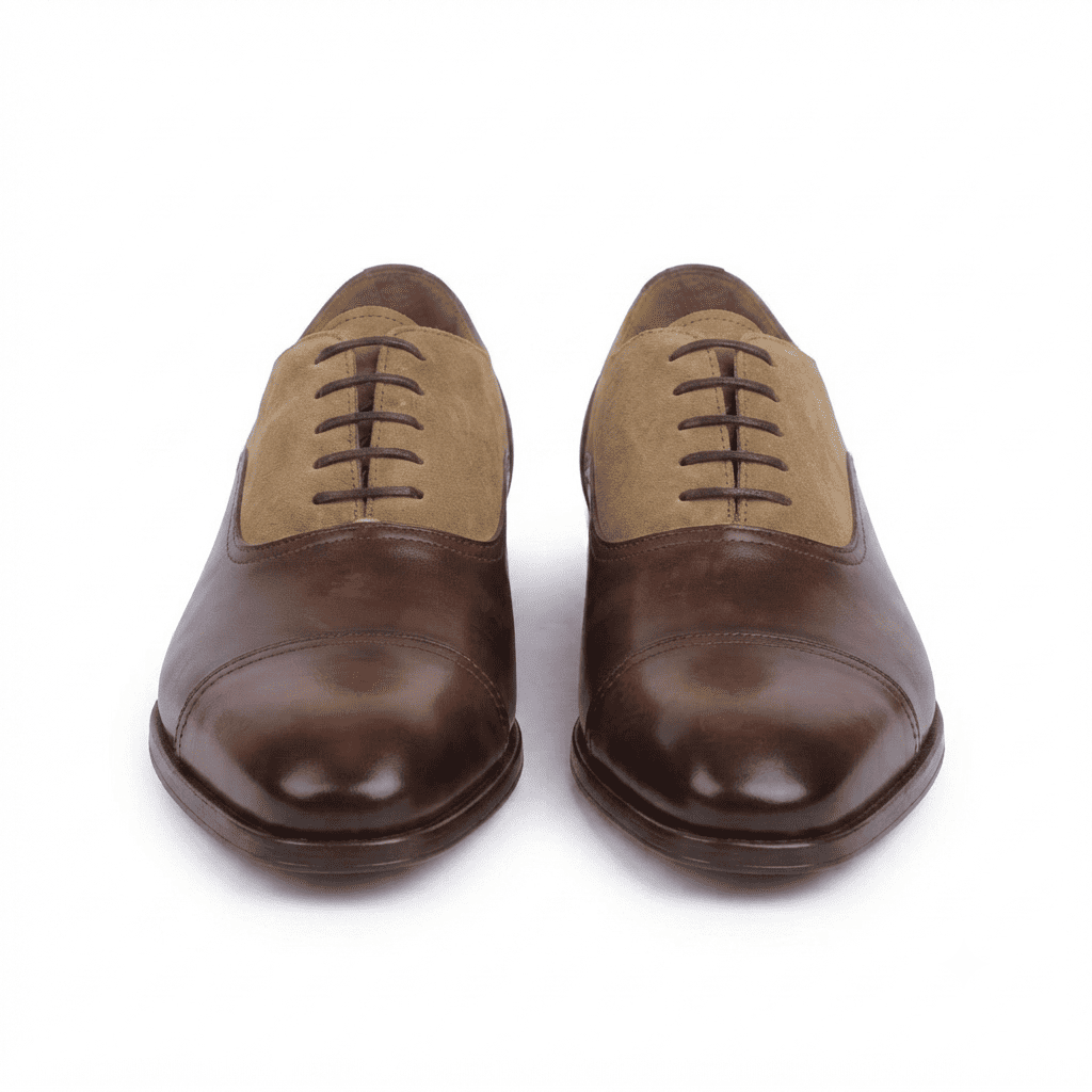 Front view of premium two-tone Oxford dress shoes showcasing classic closed-lace design