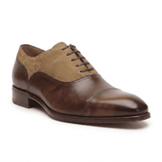 Side profile of handcrafted two-tone Oxford leather formal shoes with closed lacing