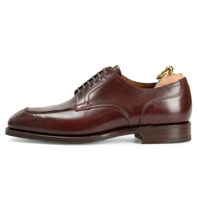 Side profile of burgundy leather Oxford formal shoes